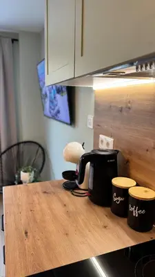 a kitchen counter top with a coffee pot on it at Urban Hive - Central Designer Studio in Lozenets in Sofia