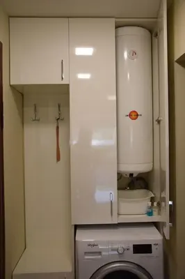 a kitchen with a washing machine and a white cabinet at Zlati`s house 1 in Sofia