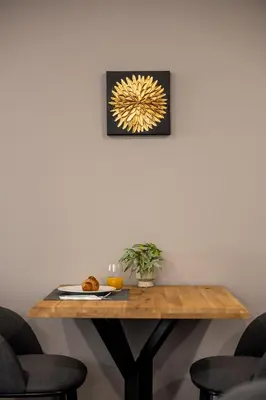 a table with a plate of food on top of it at Acacia Hotel in Sofia