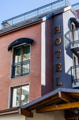 a hotel sign on the side of a brick building at Acacia Hotel in Sofia