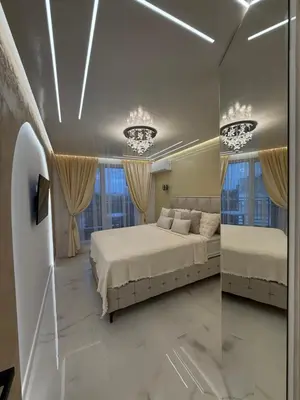 a bedroom with two beds and two windows at RICH apartment in Plovdiv