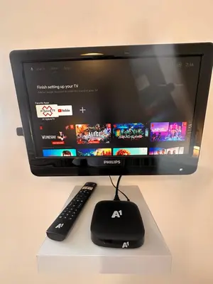 a computer monitor with a keyboard and a remote control at Private large apartment in Iglika 2 for 4 people in Borovets