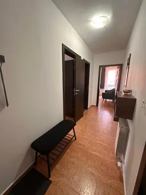 a hallway with a door and a bench in a room at Private large apartment in Iglika 2 for 4 people in Borovets