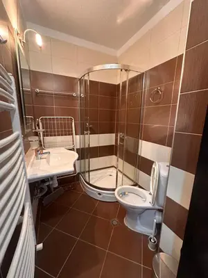 a bathroom with a shower and a toilet and a sink at Private large apartment in Iglika 2 for 4 people in Borovets