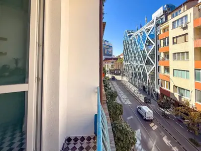 a view of a street from a balcony of a building at Lift - Duplex - King Beds - 5min to Vitosha in Sofia