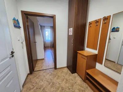 a room with a hallway with a mirror and a door at Mountain Dream apartment near ski road in Bansko