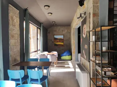 a dining room with blue chairs and a table at Apartment E45 in Borovets Gardens, Borovets resort in Borovets