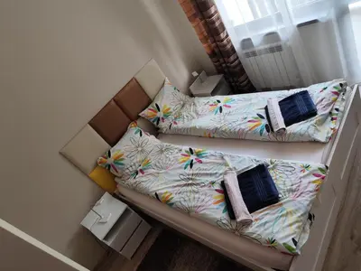 an overhead view of a couch with pillows at Apartment E45 in Borovets Gardens, Borovets resort in Borovets
