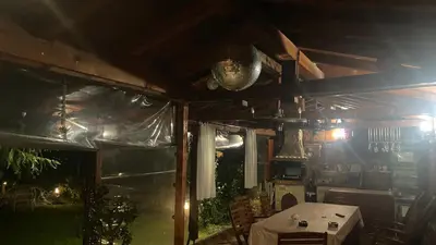 a dining room with a table and a tent at Guest House Simona in Sapareva Banya