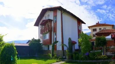 a house with a roof on top of a yard at Guest House Simona in Sapareva Banya