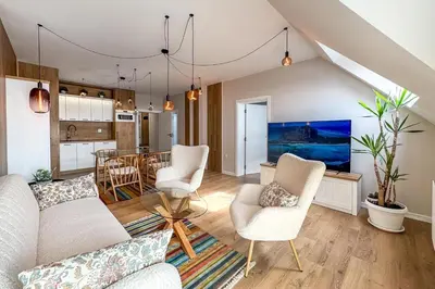 a living room with a couch and chairs and a table at ARHEYA 2 apart АРХЕЯ 2 апартамент за гости in Karlovo