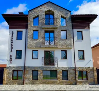 a tall brick building with windows on top of it at Къща за гости Станковата къща in Belchin