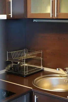 a dish rack sitting on top of a kitchen counter at Pirin Elegance Apartment by Gondola Lift in Bansko