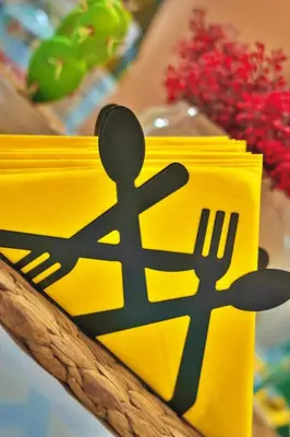 a yellow sign with a person sitting on a table at The Heart of Sofia just steps away from Vitoshka in Sofia