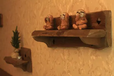 three stuffed animals sitting on a shelf on a wall at Апартамент Орфинда- Pamporovo in Pamporovo