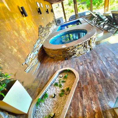 a pool on the deck of a house at Апартамент Орфинда- Pamporovo in Pamporovo