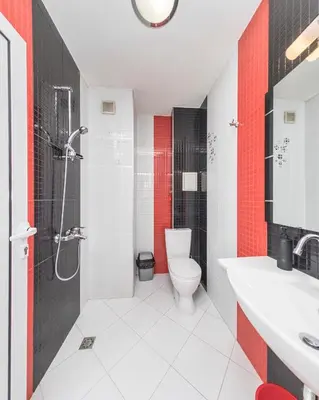 a bathroom with a toilet and a shower and a sink at Central Sofia Apartment & FREE Underground Garage in Sofia