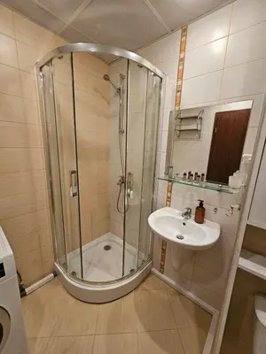 a bathroom with a shower and a sink at Charming Apartment Borovets Gardens D16 in Samokov