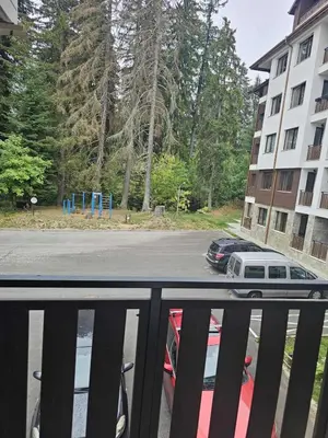 a view of a parking lot from a balcony at Charming Apartment Borovets Gardens D16 in Samokov