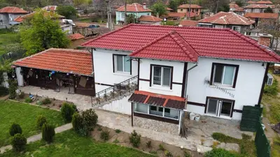 an aerial view of a house with a red roof at Дядо Пановата къща
