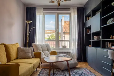 a living room with a couch and a window at Retro-Chic 1BR Apartment next to Vasil Levski Blvd by Flat Mаnager in Sofia