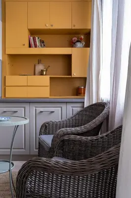two wicker chairs in a room with a table at Retro-Chic 1BR Apartment next to Vasil Levski Blvd by Flat Mаnager in Sofia