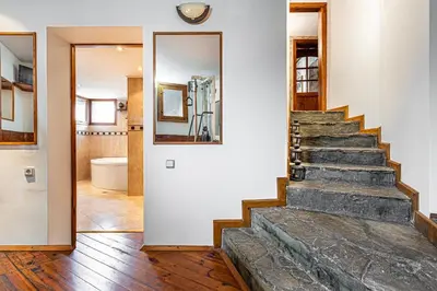 a hallway with a stone staircase in a house at Villa TIANA Bansko 7-Bedroom Luxury Chalet in Bansko