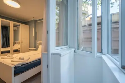 a bedroom with a bed and a window at Stylish & Funcional 1 BDRM apt in Sofia's heart in Sofia