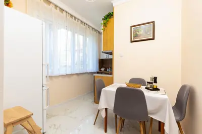 a kitchen and dining room with a table and chairs at City Retreat with Local Charm in Plovdiv