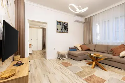 a living room with a couch and a table at City Retreat with Local Charm in Plovdiv