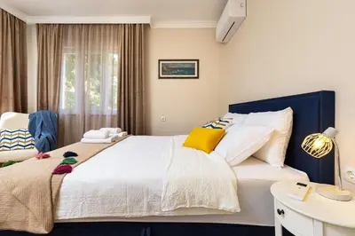 a bedroom with a large white bed and a desk at City Retreat with Local Charm in Plovdiv