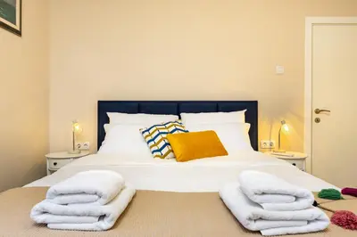 a bedroom with a bed with towels on it at City Retreat with Local Charm in Plovdiv