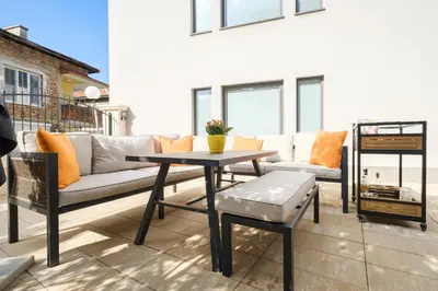 a living room with a couch and a table at The House of Pom in Plovdiv