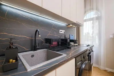 a kitchen with a sink and a counter top at The House of Pom in Plovdiv
