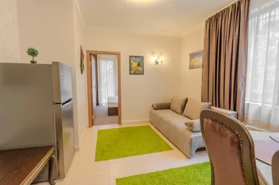a living room with a couch and a table at 2R Ski - ТуЕр Ски in Smolyan