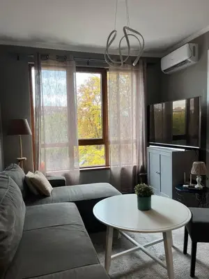 a living room with a couch and a table at Kate House in Sofia