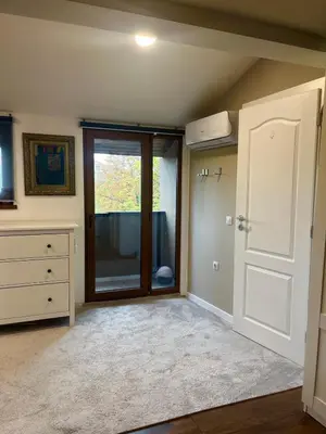an empty room with a door and a window at Kate House in Sofia