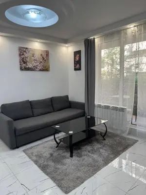 a living room with a couch and a table at Top Central Apartment 14 in Sofia