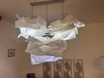 a bunch of white papers hanging from a chandelier at Emily Pirin Golf in Razlog