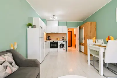 a kitchen with a couch and a table at Armand de Sanelle in Sofia