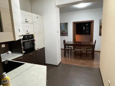 a kitchen with a table and a dining room at Cinema house at Sofia center in Sofia