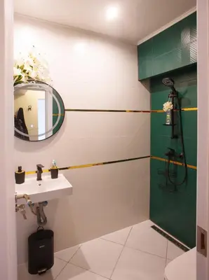 a bathroom with a sink and a mirror at Serdica Tower View DT Parking Wi-Fi AC in Sofia