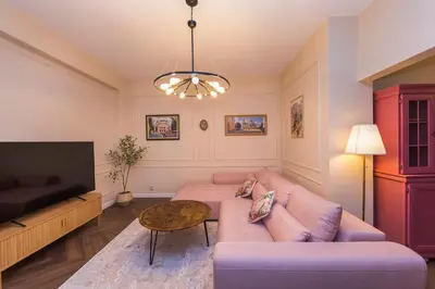 a living room with a couch and a table at The Pearl Downtown in Sofia