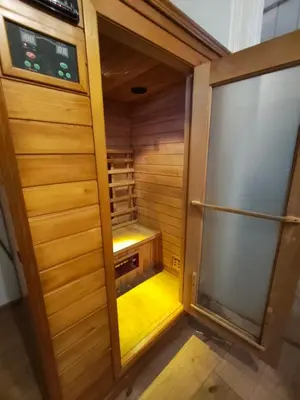 a sauna with a glass door in a room at Stylish apartment, top center with private Sauna! in Sofia