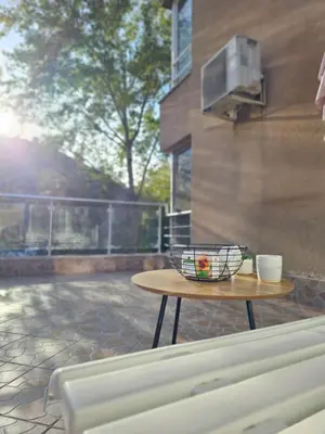 a bowl on a table on a patio at Two Big Bed Apartment & FREE Underground Parking in Sofia