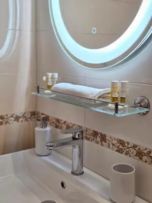 a bathroom with a sink and a mirror at Two Big Bed Apartment & FREE Underground Parking in Sofia