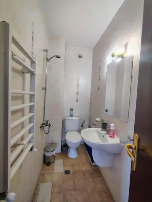 a bathroom with a toilet and a sink at Fairytale Cottage in Redenka in Razlog