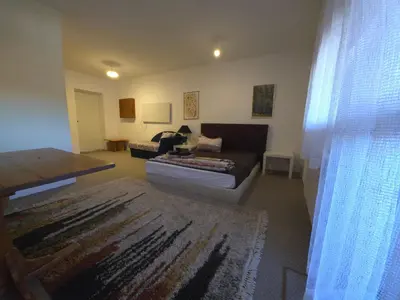 a living room with a couch and a table at Къща за гости У Нико in Orehovo