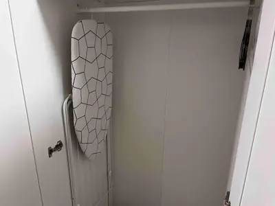 a bathroom with a mirror hanging on the wall at TwinStay #6 - Deluxe Super King Suite in Sofia