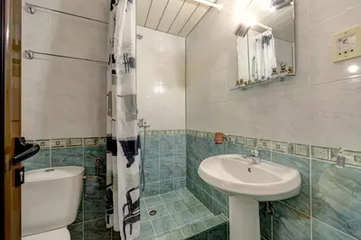 a bathroom with a toilet and a sink at Hotel Borovets Palace in Borovets